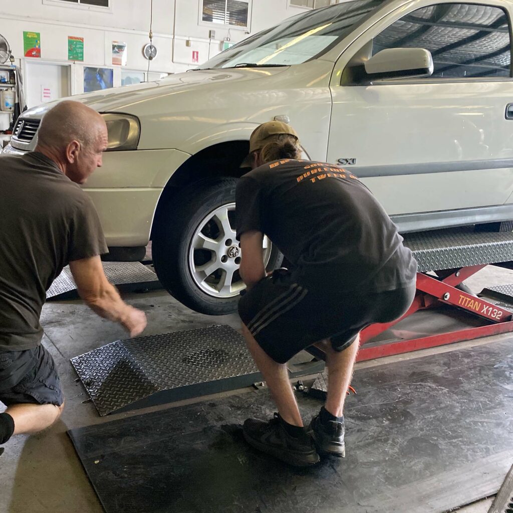 Chris Lett assisting a tyre replacement at the Branigans Burleigh Heads branch in the Gold Coast.