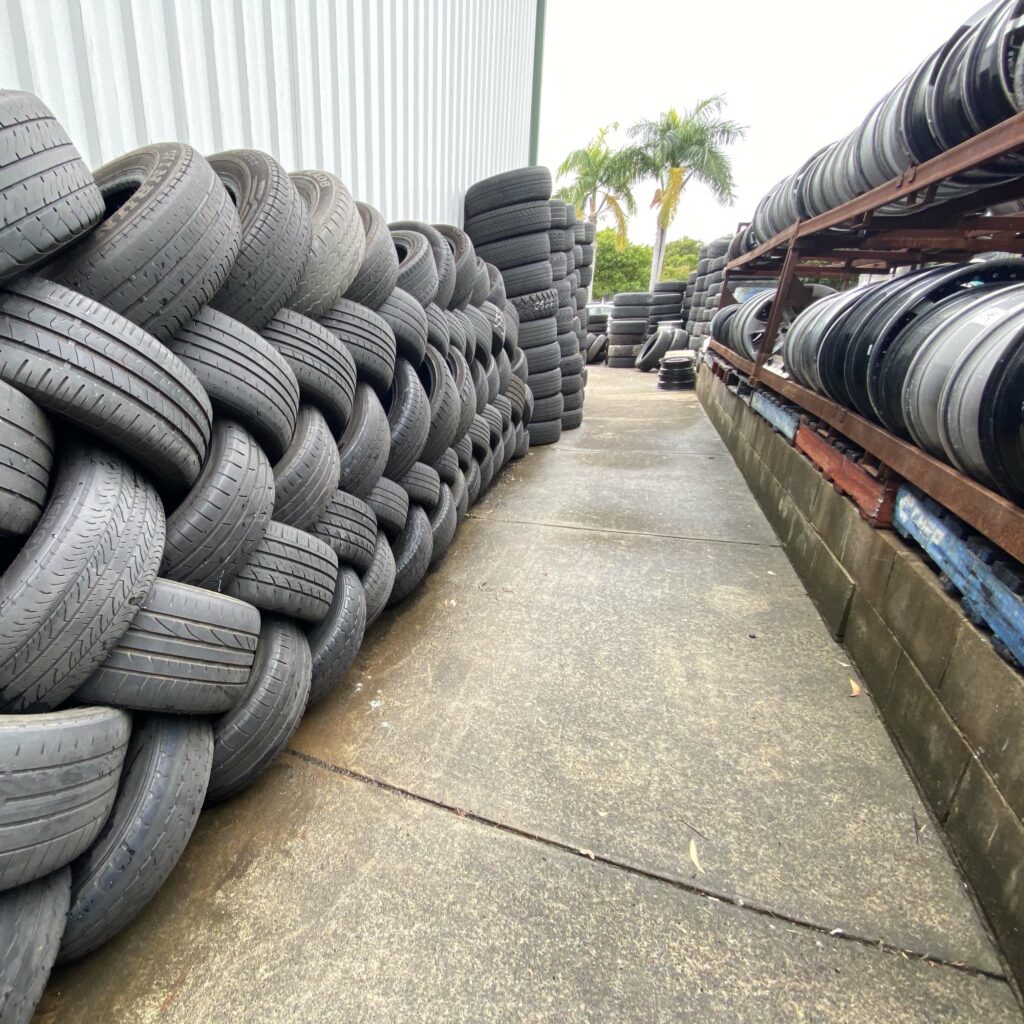 Tyres stacked against the wall outside Branigans Tyres in the Gold Coast.