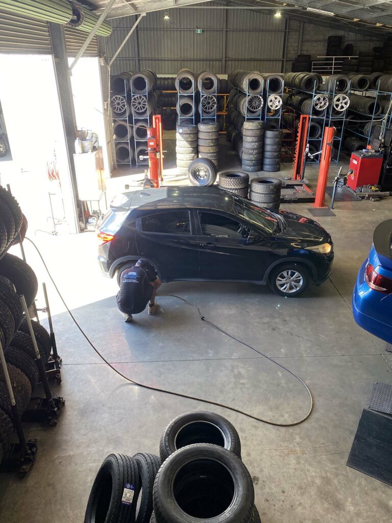 Checking tyre pressure at the Burleigh Heads branch in the Gold Coast.