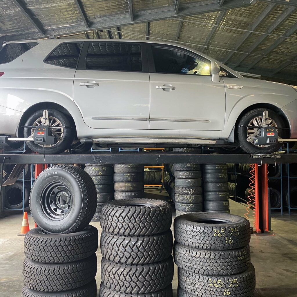 Wheel alignment being done on a car at the Branigans Burleigh Heads tyre shop in the Gold Coast.