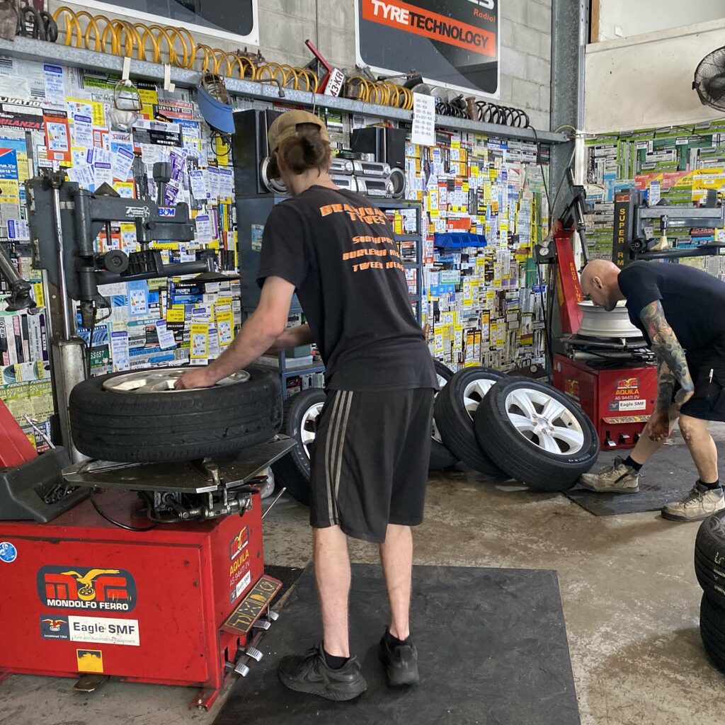 Staff replacing tyres at Branigans Tyres in the Gold Coast.