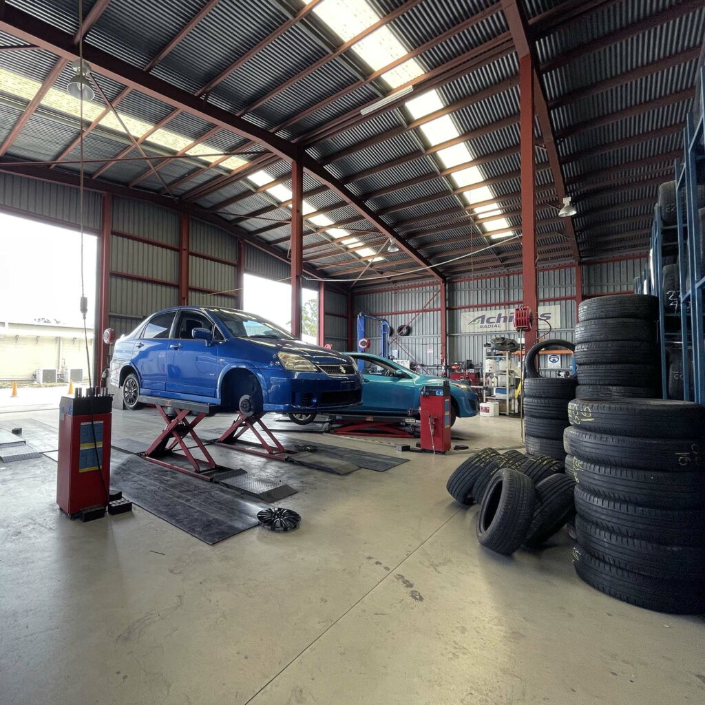 Car being fitted with replacement tyres at Branigans Tyres in the Gold Coast.