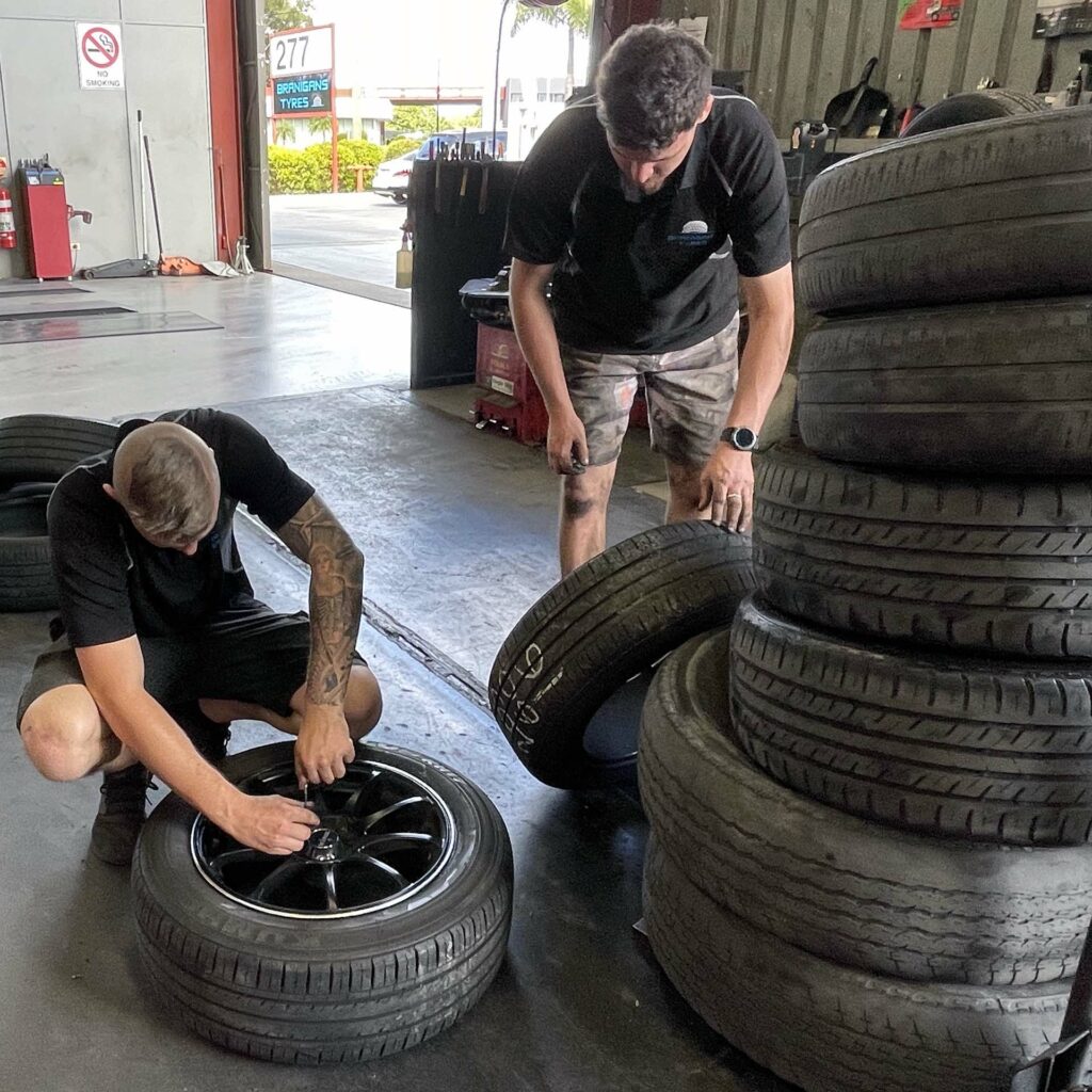 Putting on new tyres at the Branigans Southport tyre shop in the Gold Coast.